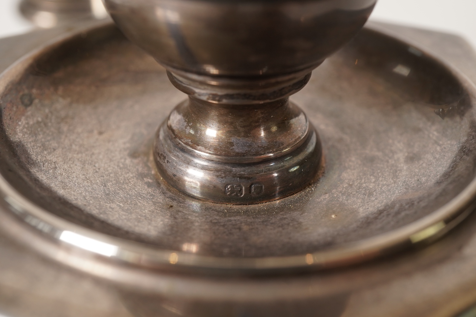 An Elizabeth II silver three branch, three light candelabrum, by William Comyns & Sons Ltd